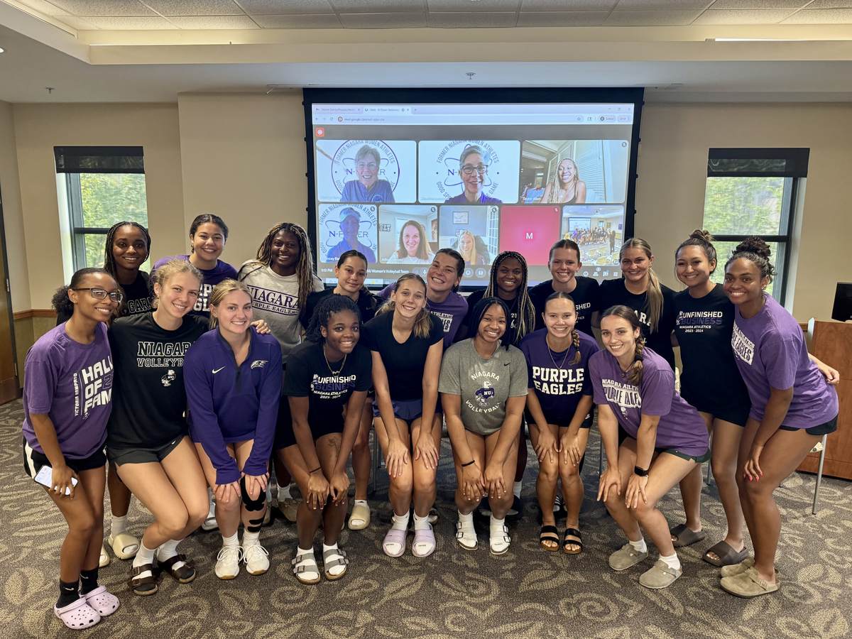 Niagara women athletes gathered together at a community event