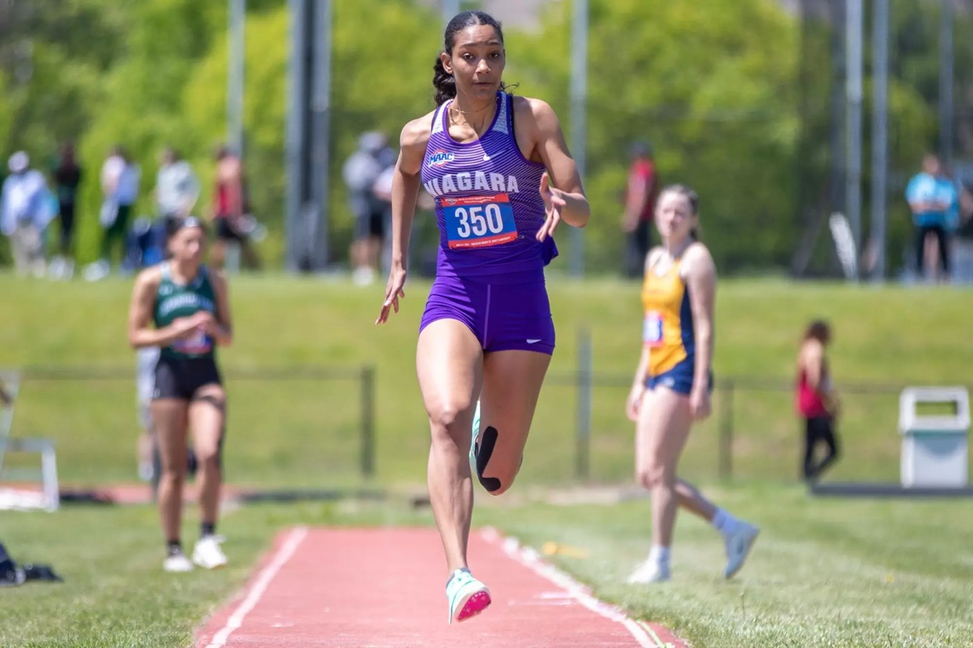 Niagara women’s track and field athlete competing on the track