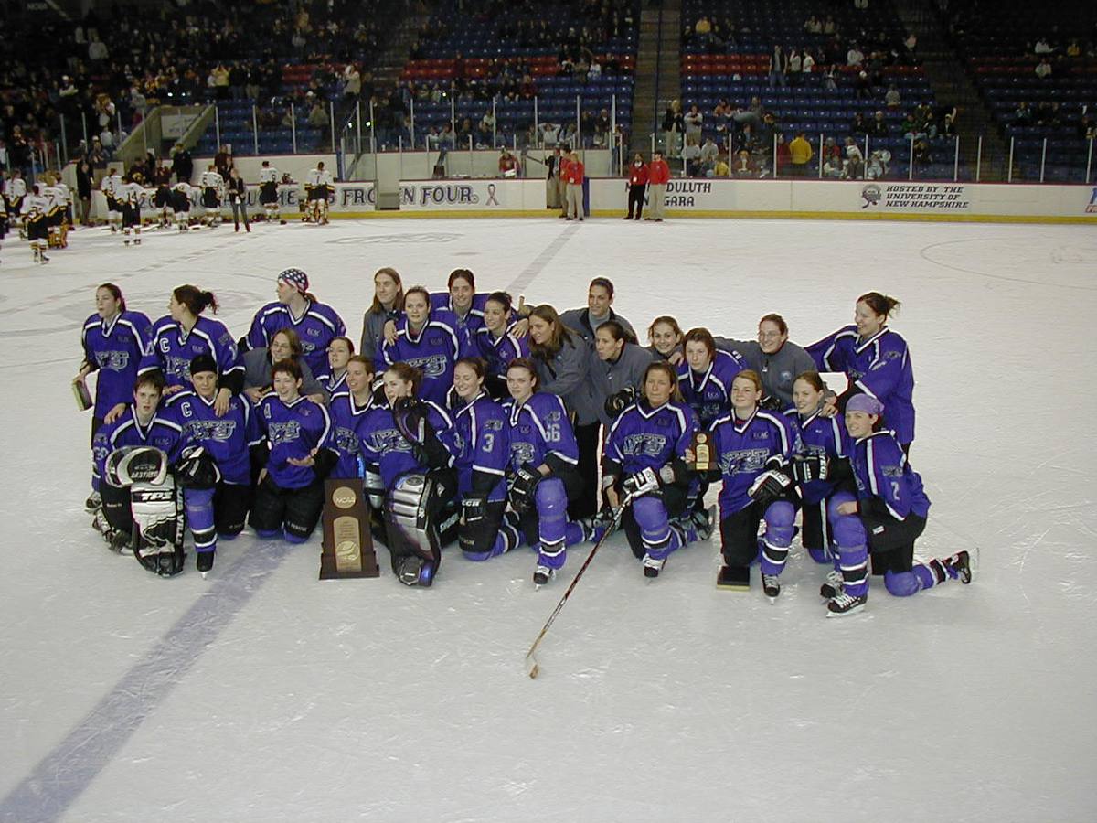 Archival women’s hockey team gathered together on the ice